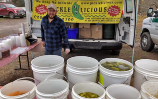 Pickle vendor at Hunterdon Land Trust Winter Farmers' Market in Flemington, NJ
